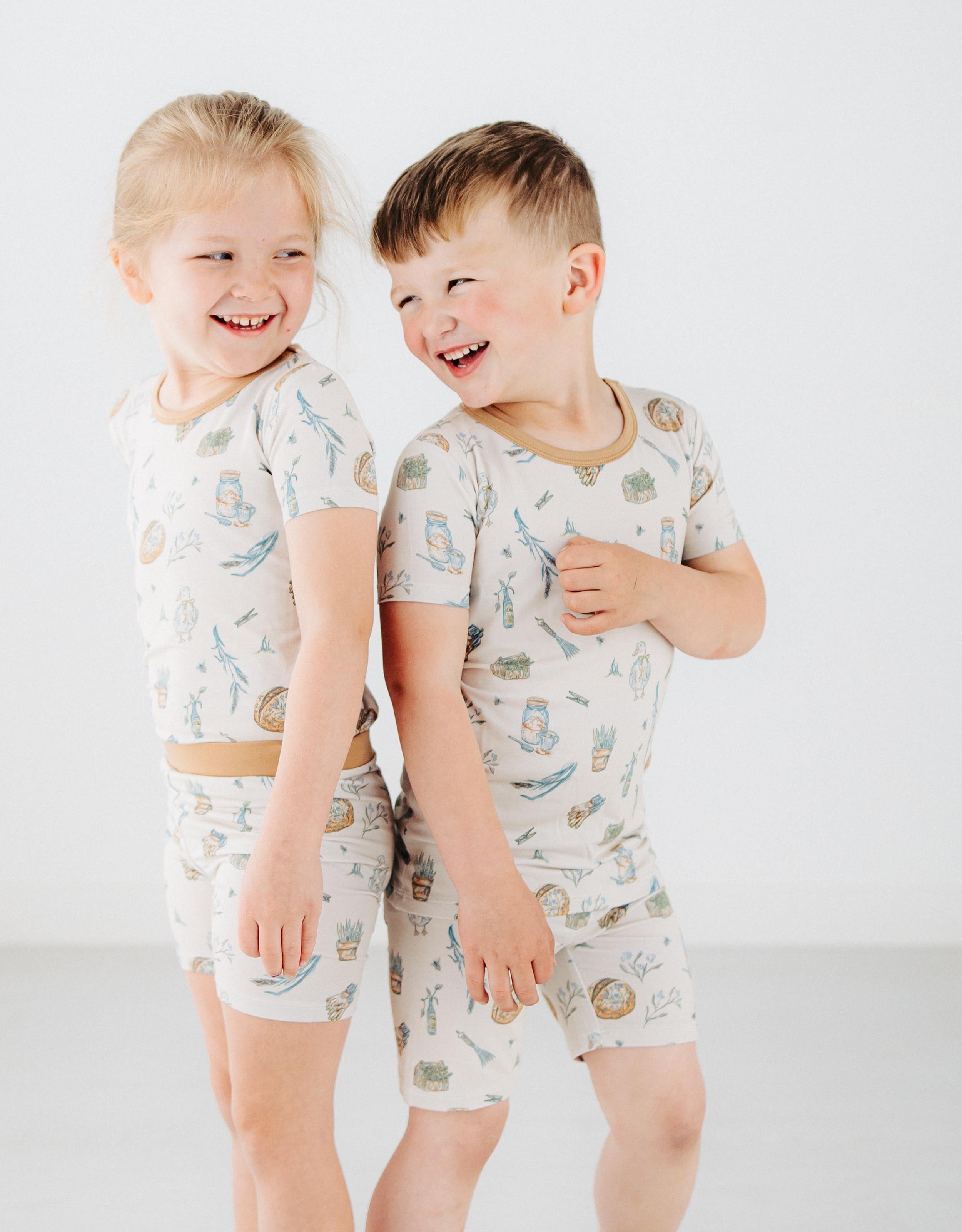 boy and girl playing together in Meadow Lane Kids Heirloom Homestead kids pajamas