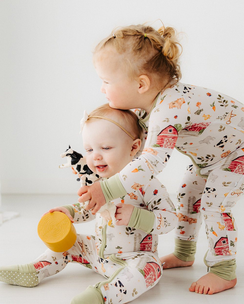 toddlers wearing Meadow Lane Kids Little Farm TENCEL pajama sleeper